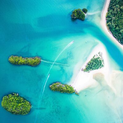 This photo was shot with my DJI Phantom 3 in Thailand, Krabi in 2016. It’s possible to get to the Sirithan Beach (sandy island) walking from the mainland (more right) in the water. The maximum depth in the most shallow path is waist-high. A little inconvenience totally worth it because the beach is almost empty and feels like a paradise.