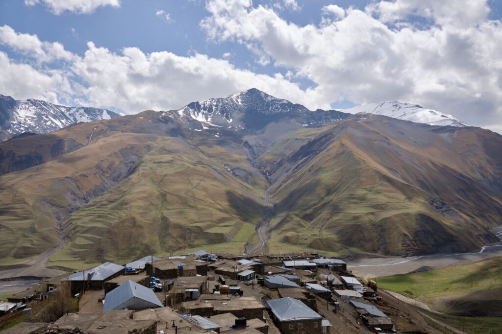 Panoramic landscape of Khinalug village nestled in the Caucasus Mountains of Azerbaijan.