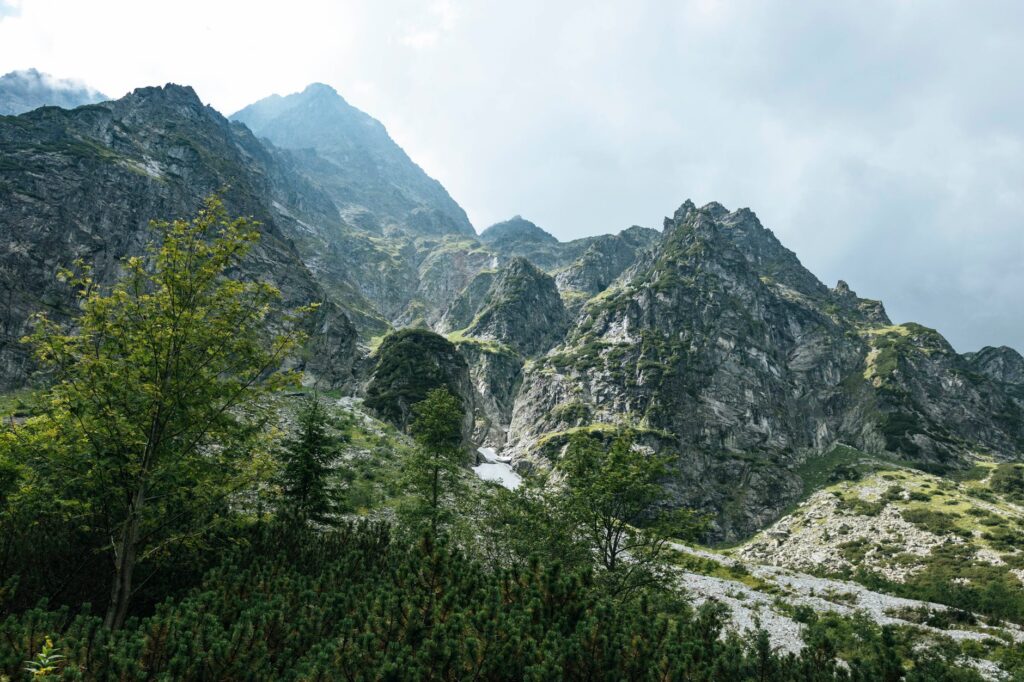 Stunning view of the Tatra Mountains under a cloudy sky, highlighting natural beauty.