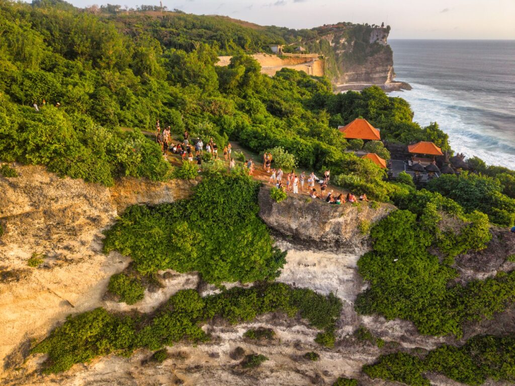 Breathtaking aerial view of Uluwatu Cliffs with lush greenery and coastal views in Bali.