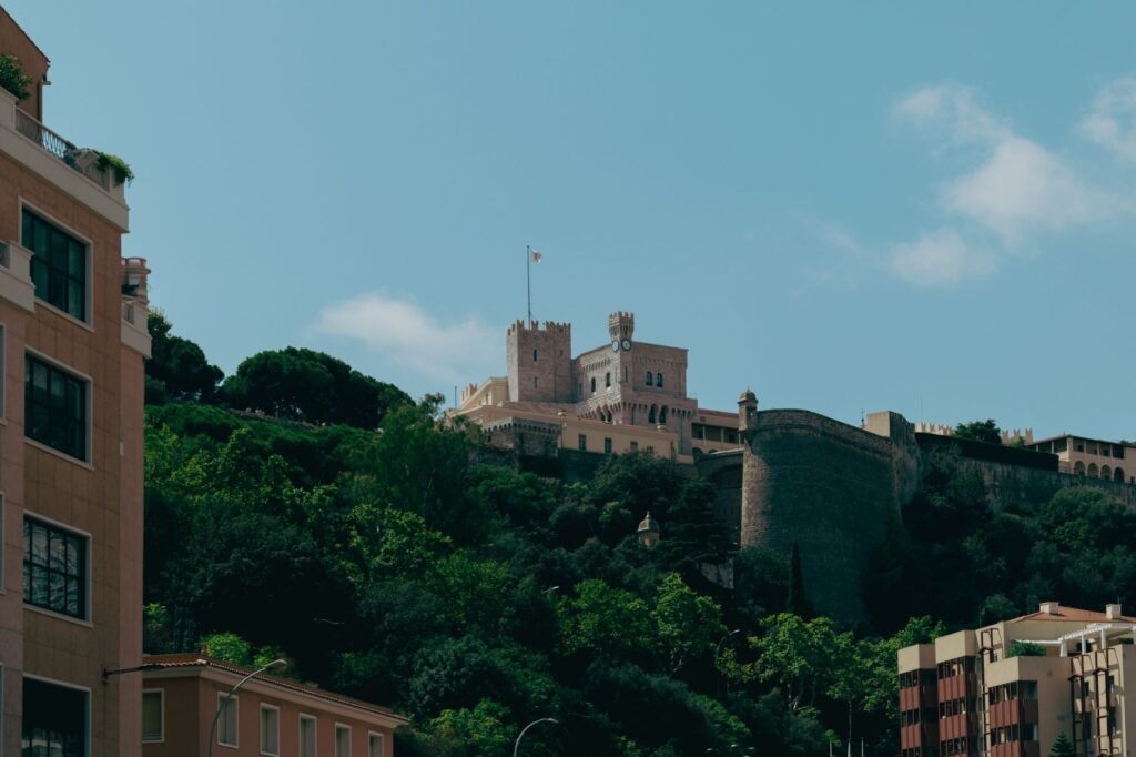 Explore the stunning Prince's Palace in Monaco, capturing its historic architecture against a vibrant backdrop.