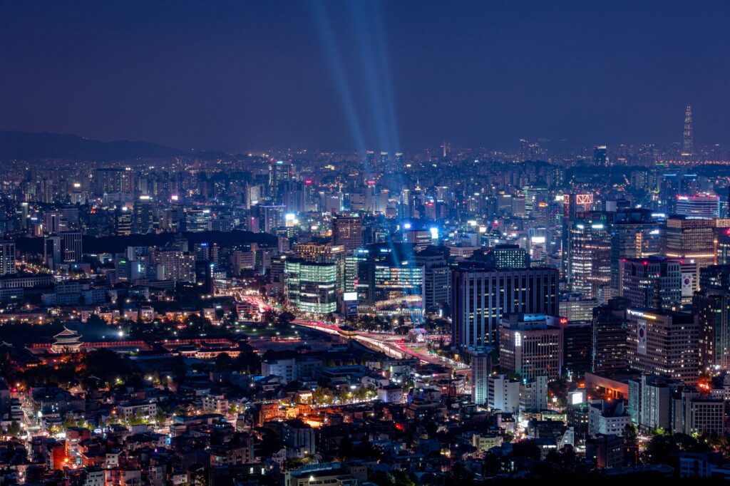 A breathtaking aerial view of a vibrant city illuminated at night.