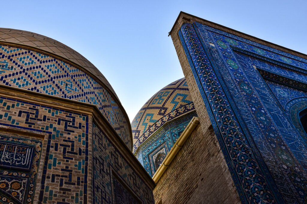 Explore the stunning mosaic patterns and domes of Shah-i-Zinda, a historic Islamic complex in Samarkand, Uzbekistan.