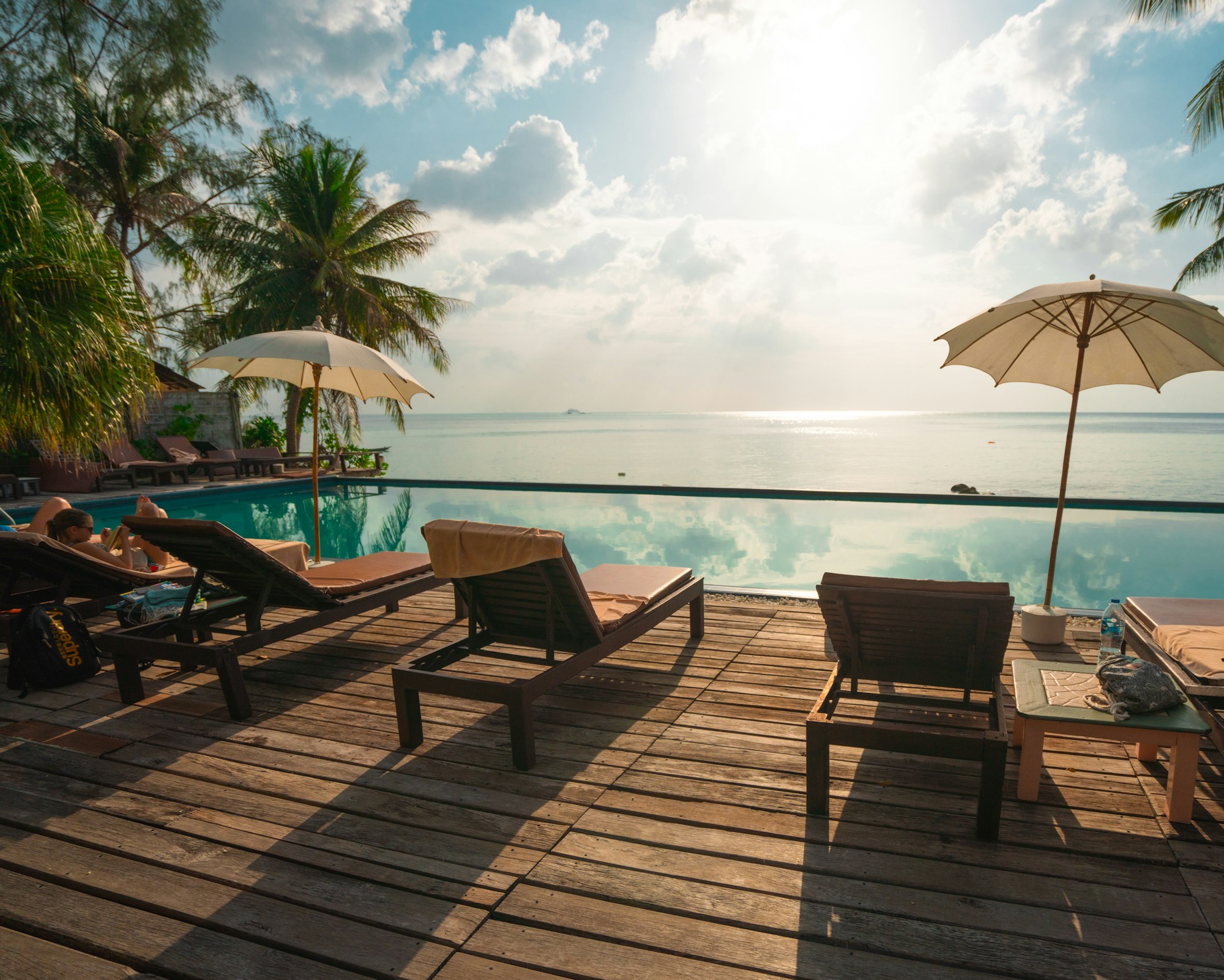 A private pool facing the sea at dusk