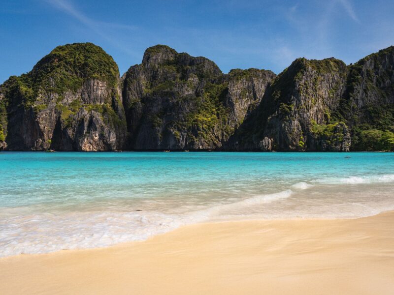 Stunning view of Maya Bay's turquoise waters and limestone cliffs in Krabi, Thailand.